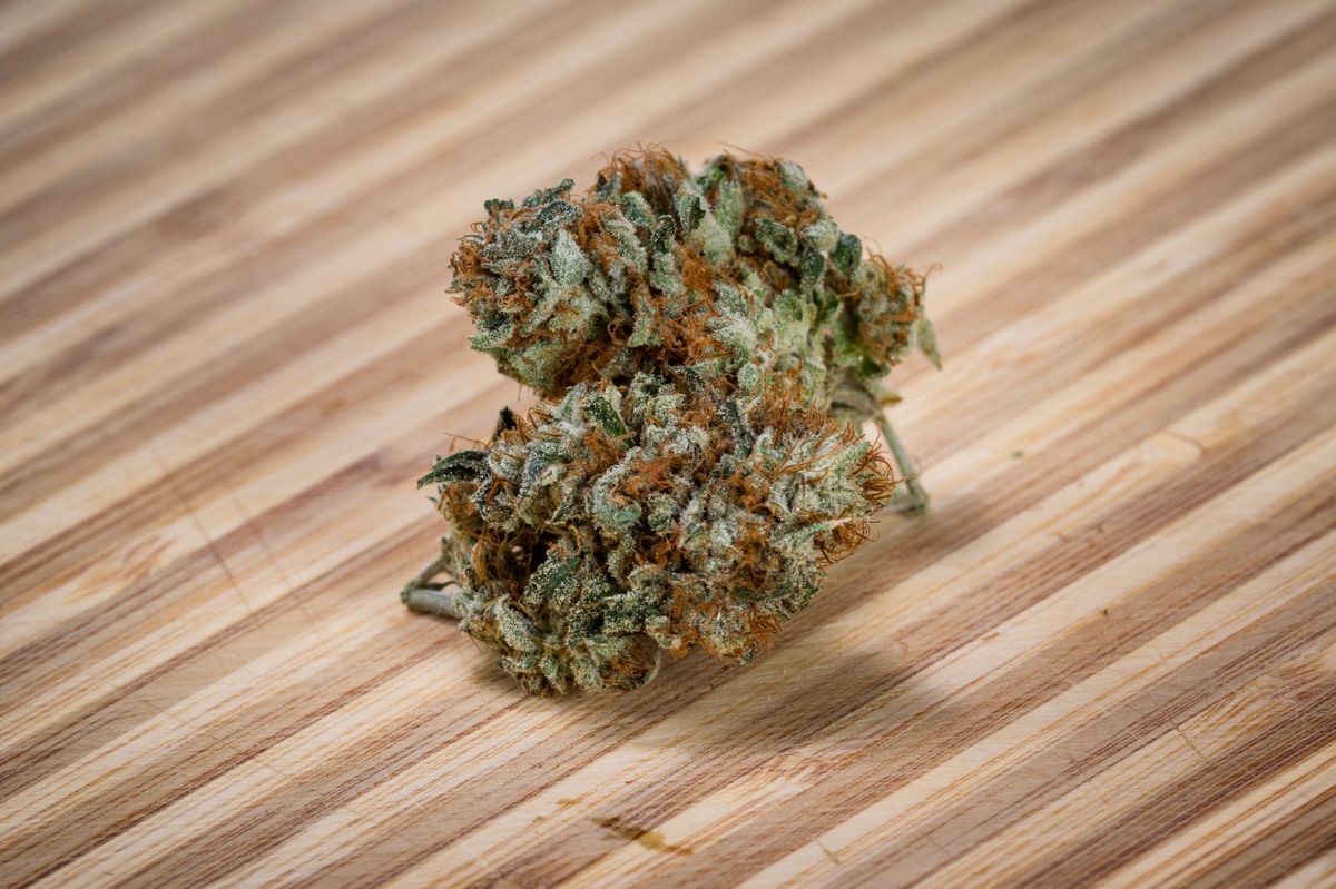 Premium cannabis flower bud on wood