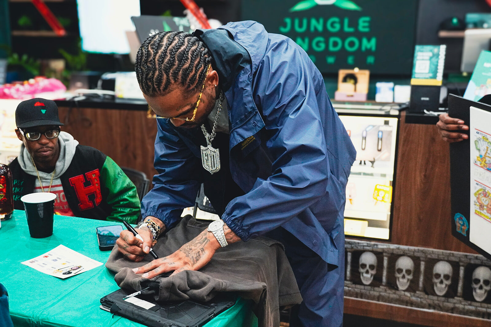 Staff signing merchandise at Jungle Kingdom Flower